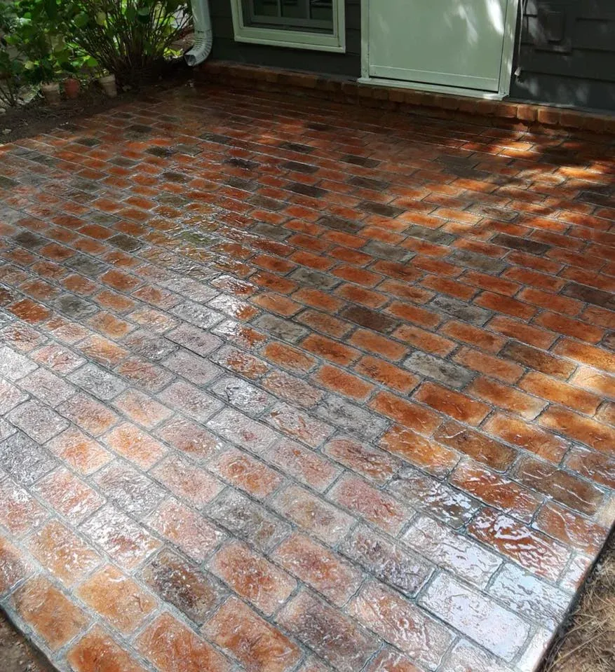 Rust stained stamped brick patio